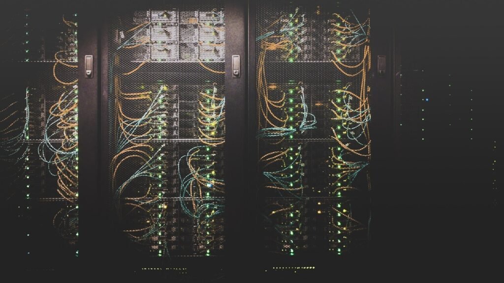 Rows of server racks with network cabling and status lights